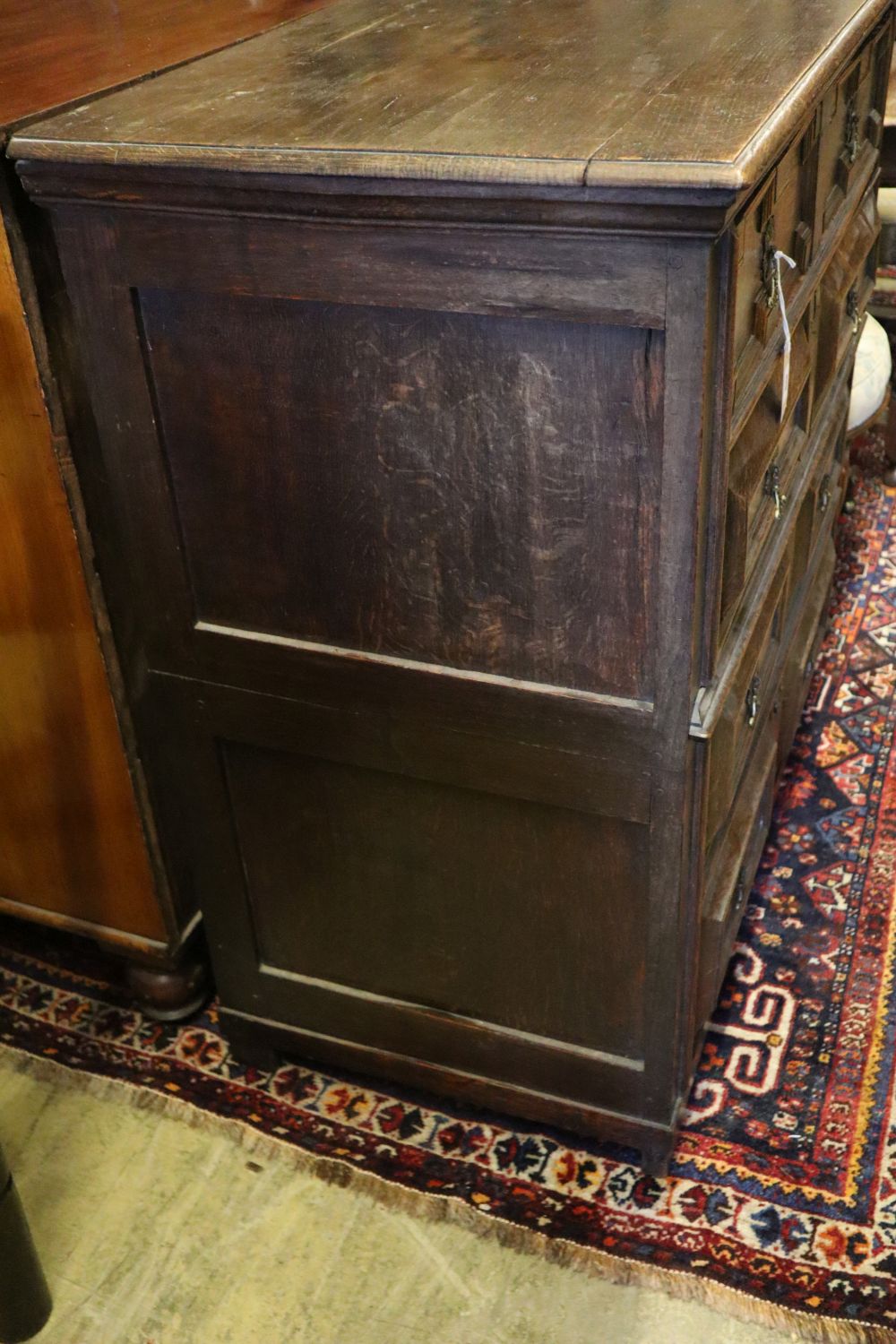 A late 17th century oak chest fitted four geometrically-moulded drawers on block feet, width 108cm depth 56cm height 104cm